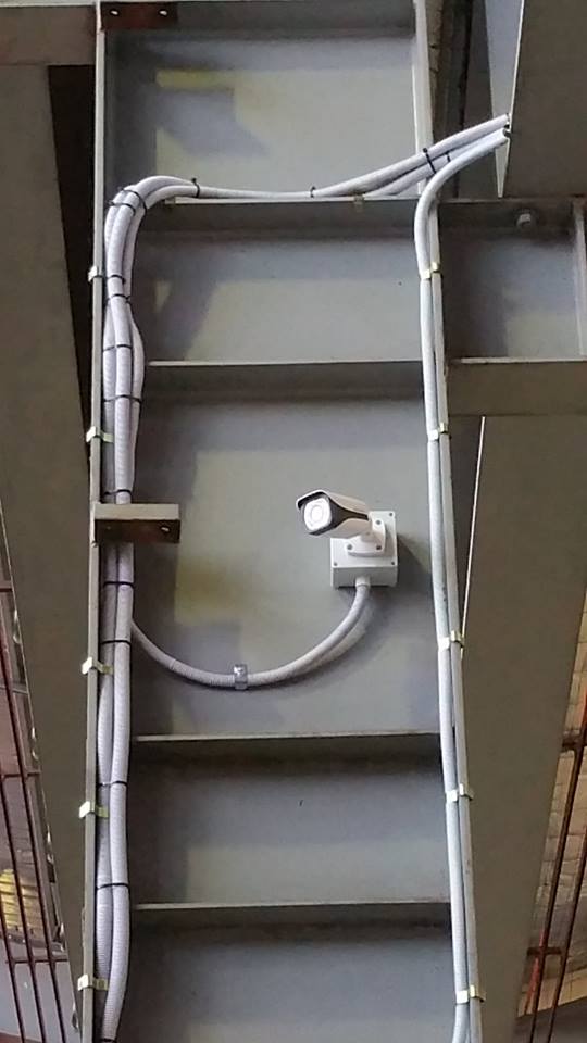 Security camera and conduit installation