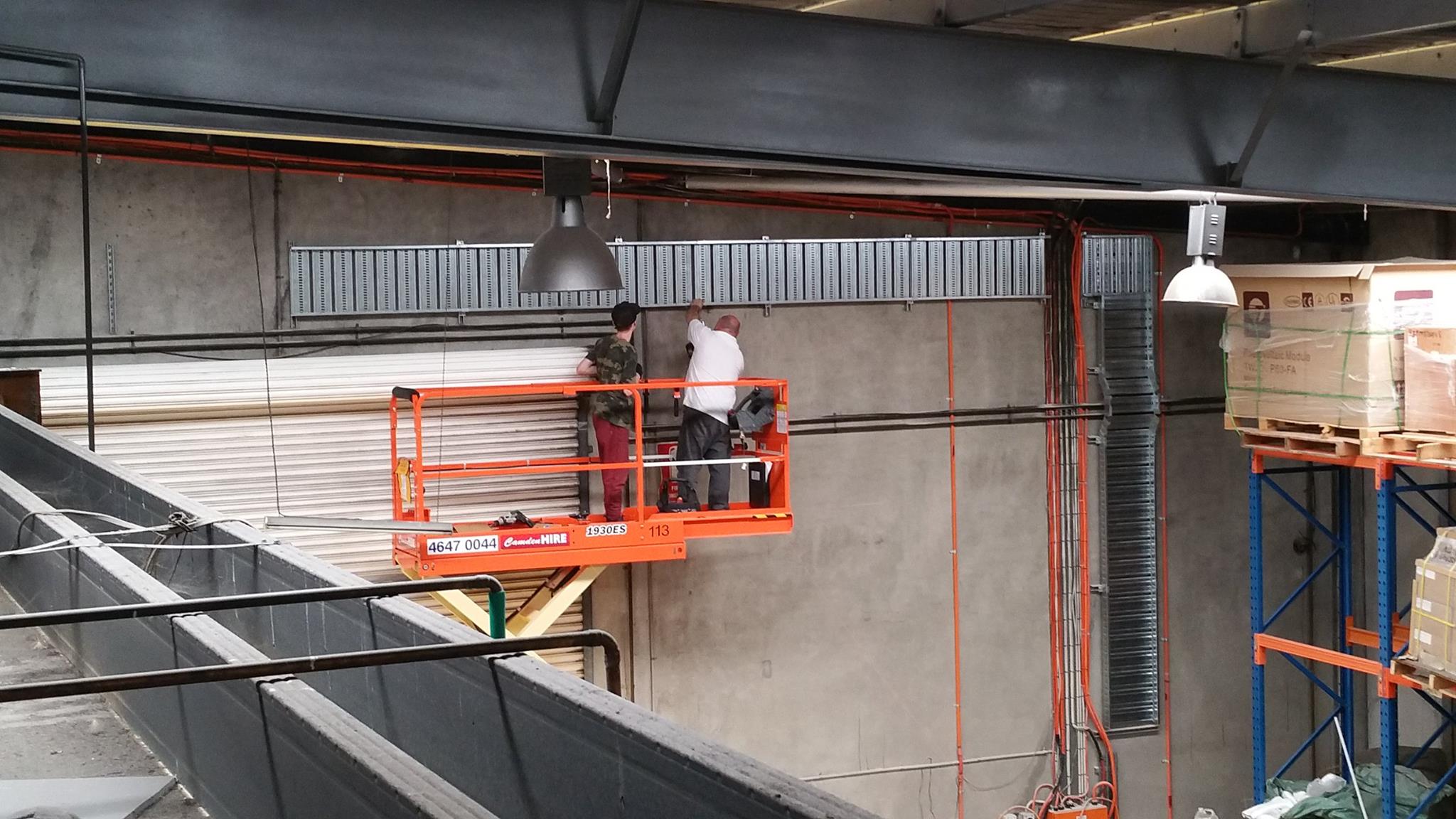 Cable tray being installed over factory roller door