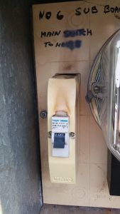 Circuit breaker in power supply cabinet showing heat damage
