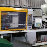 Close up view of plastic moulding machinery